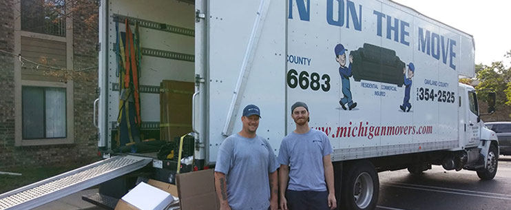 Two men and truck for moving commercial properties